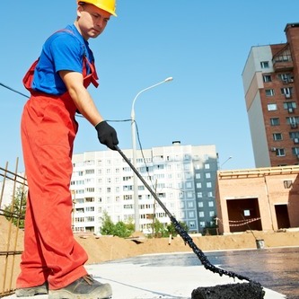 Roofer Paints on Coating.