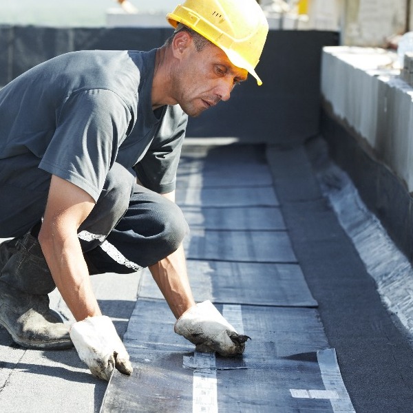 Roofer Installs Commercial Roofing