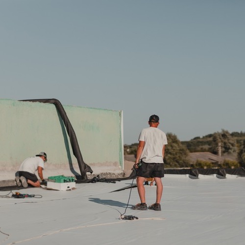 Roofers Work on TPO Roofing
