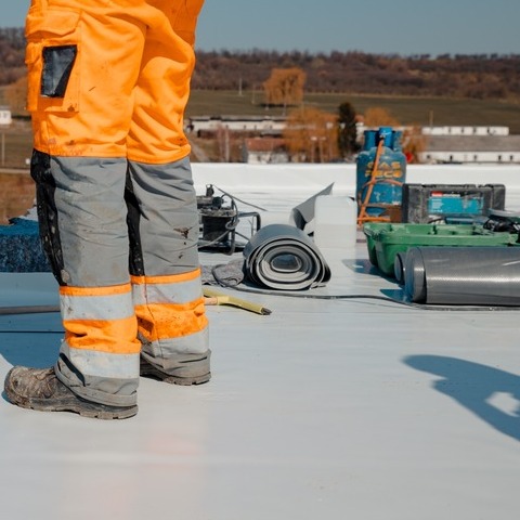 A Roofer With PVC or TPO Roofing.