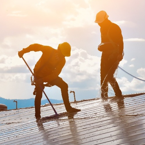 Roofers Clean a Roof.