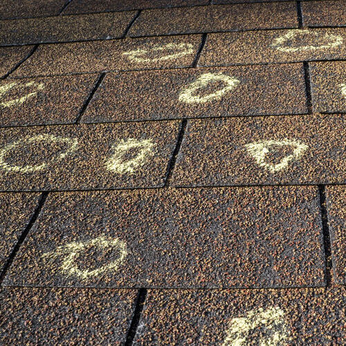 Hail Damage Marked in Chalk on a Roof.