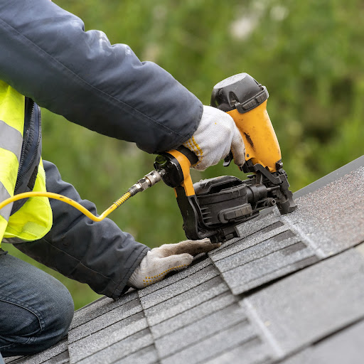 A Roofer Makes Emergency Repairs.