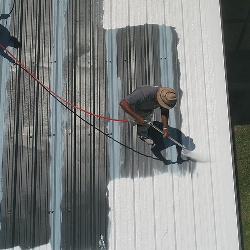 Worker Applies Silicone Coating